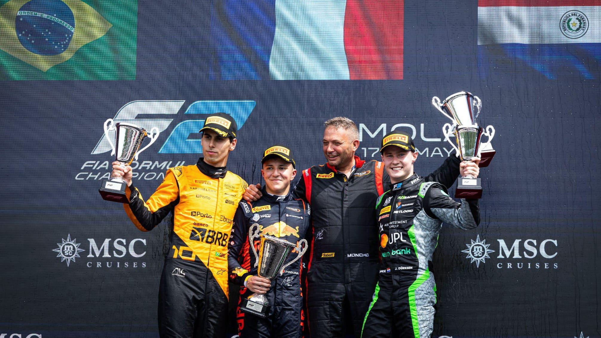 F2 Imola feature race winner Isack Hadjar (centre) with second-place finisher Gabriel Bortoleto (L) and third-place finisher Joshua Durksen (R)