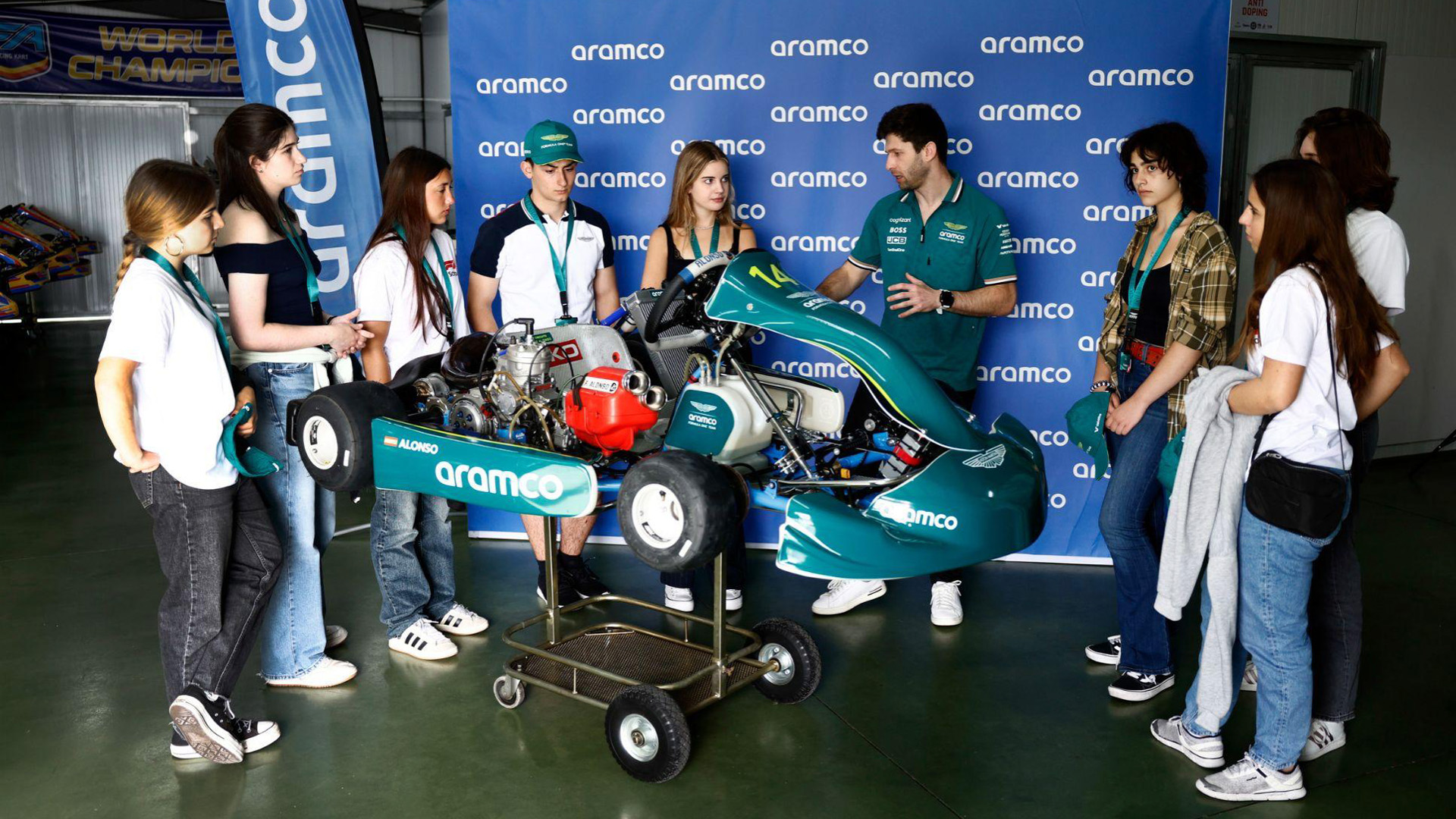 An engineer talks to students at the Aston Martin Aramco F1 Team event.