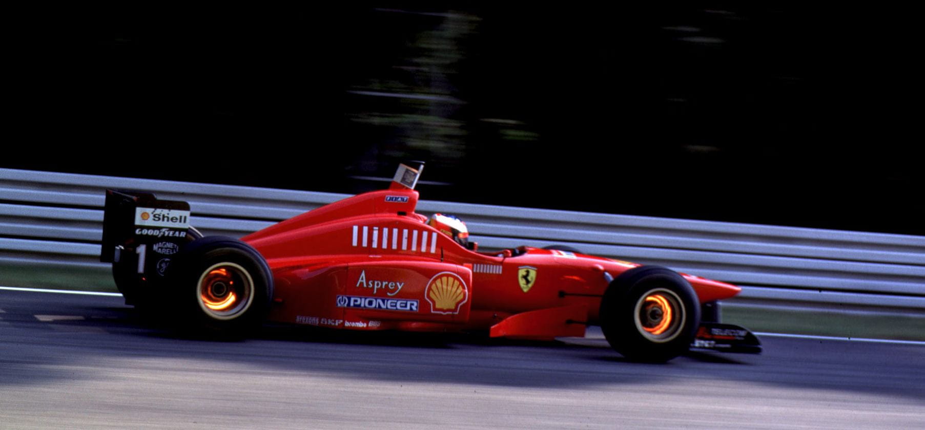 Image: Michael Schumacher’s Ferrari F310 glowing under intense braking in 1996