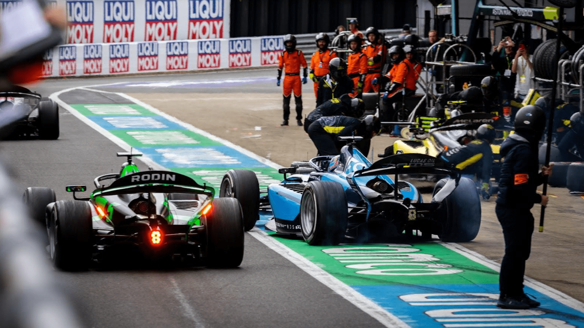 The fast lane of the pitlane (left) was resurfaced in June along with numerous parts of the track itself