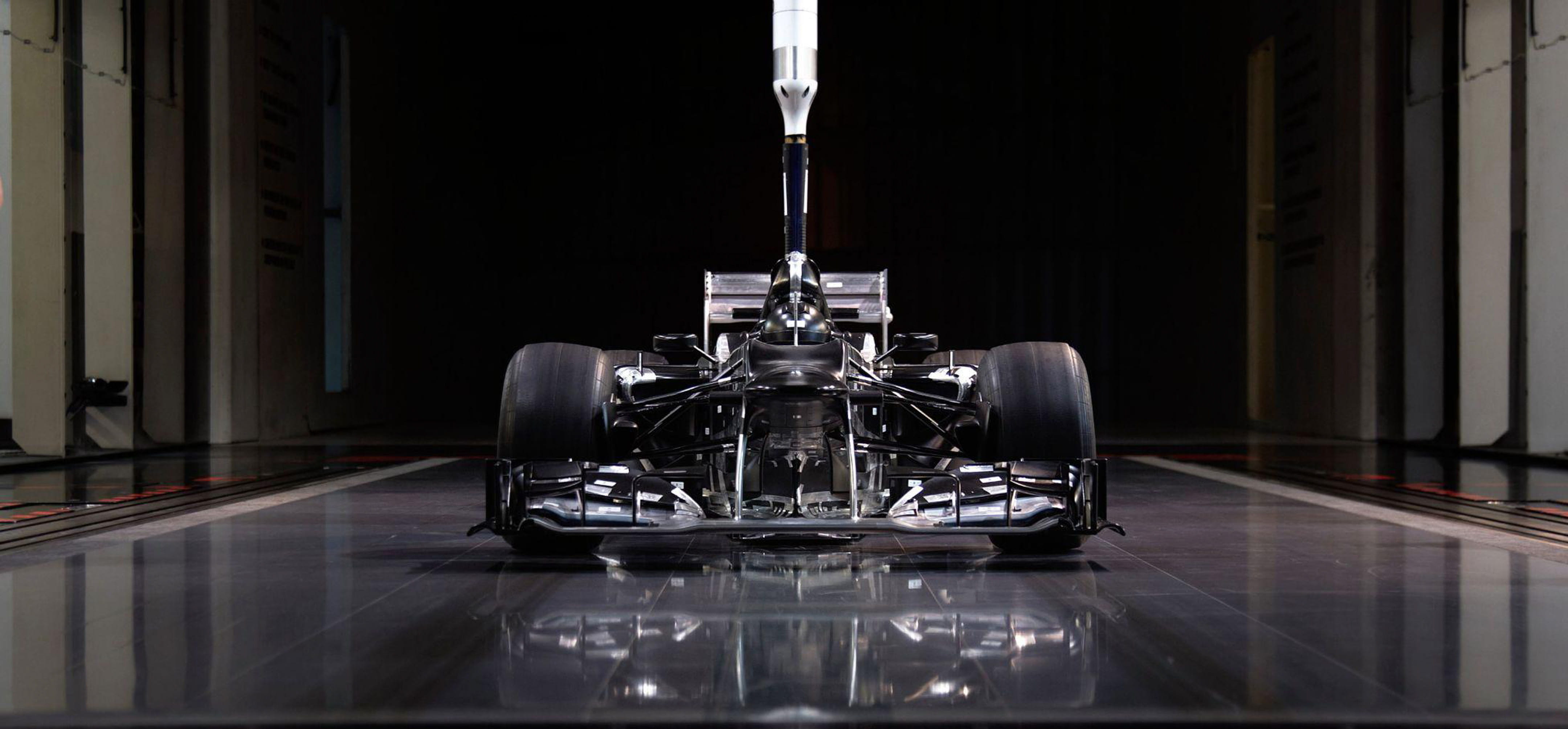 A scale-model of a Mercedes Formula 1 car in a wind tunnel. The F1 technical regulations allow for a 60% scale model of a car to be used for wind tunnels
