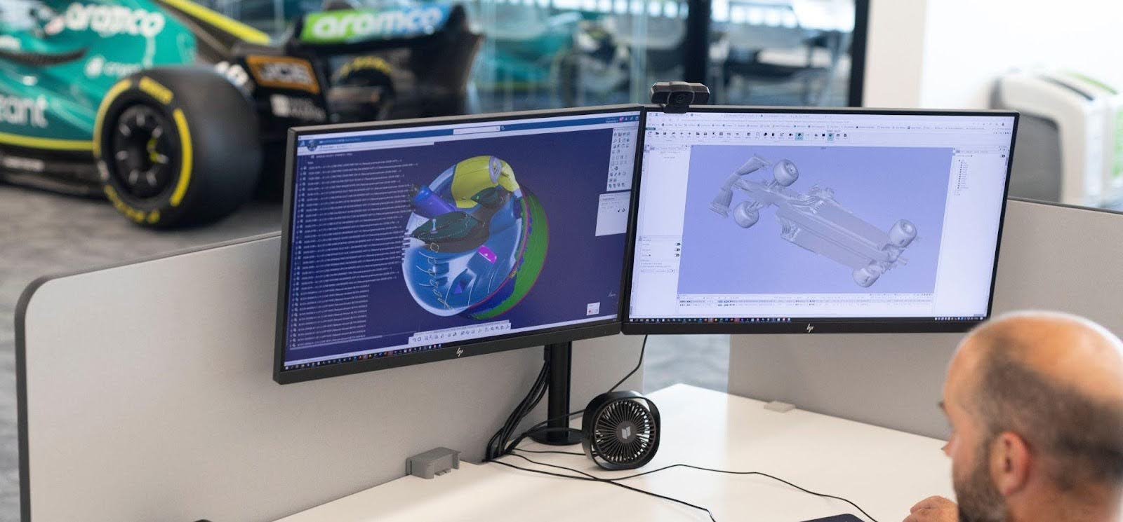 Aston Martin car designer looking at screen