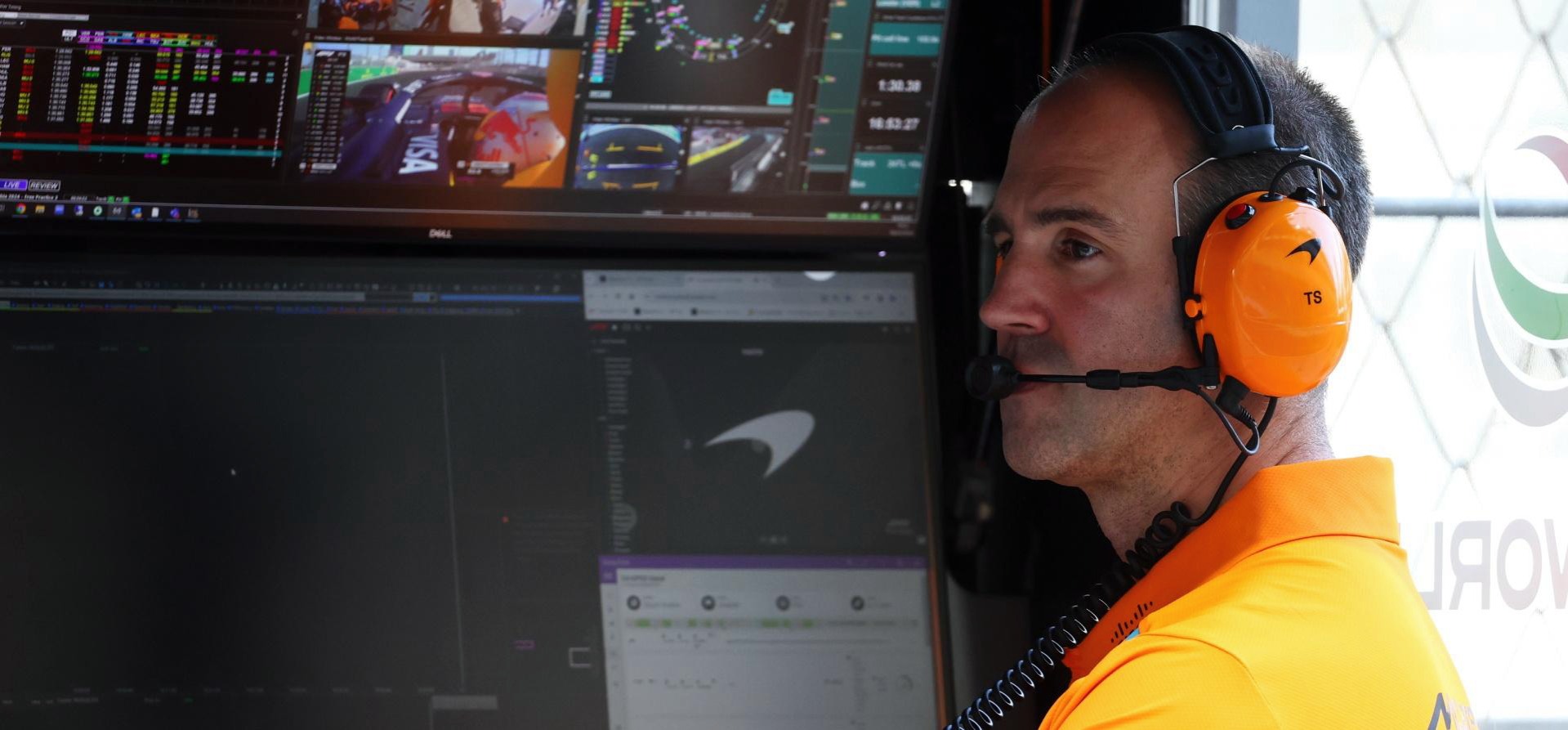 Tom Stallard, McLaren engineer, sitting on pitwall