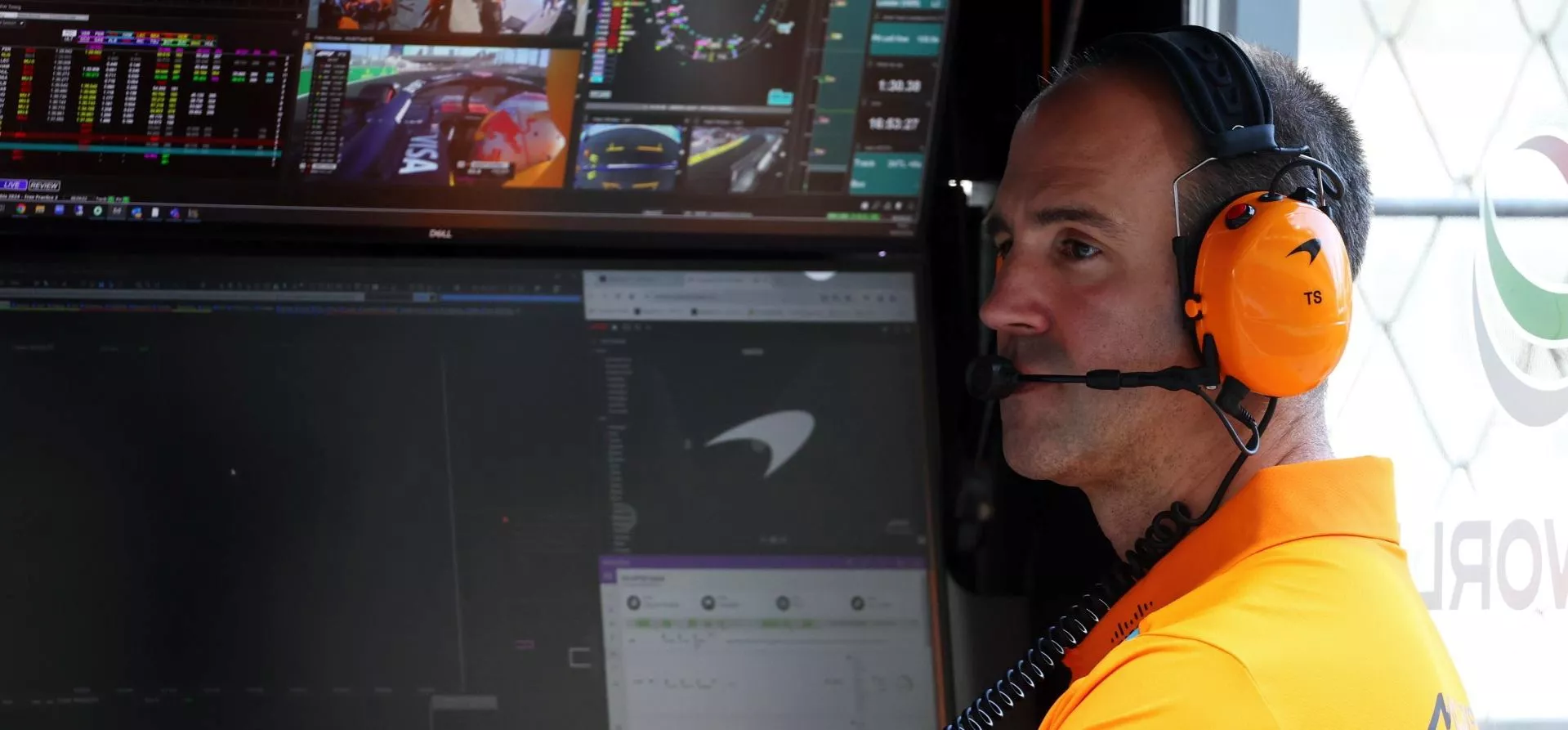 Tom Stallard, McLaren engineer, sitting on pitwall
