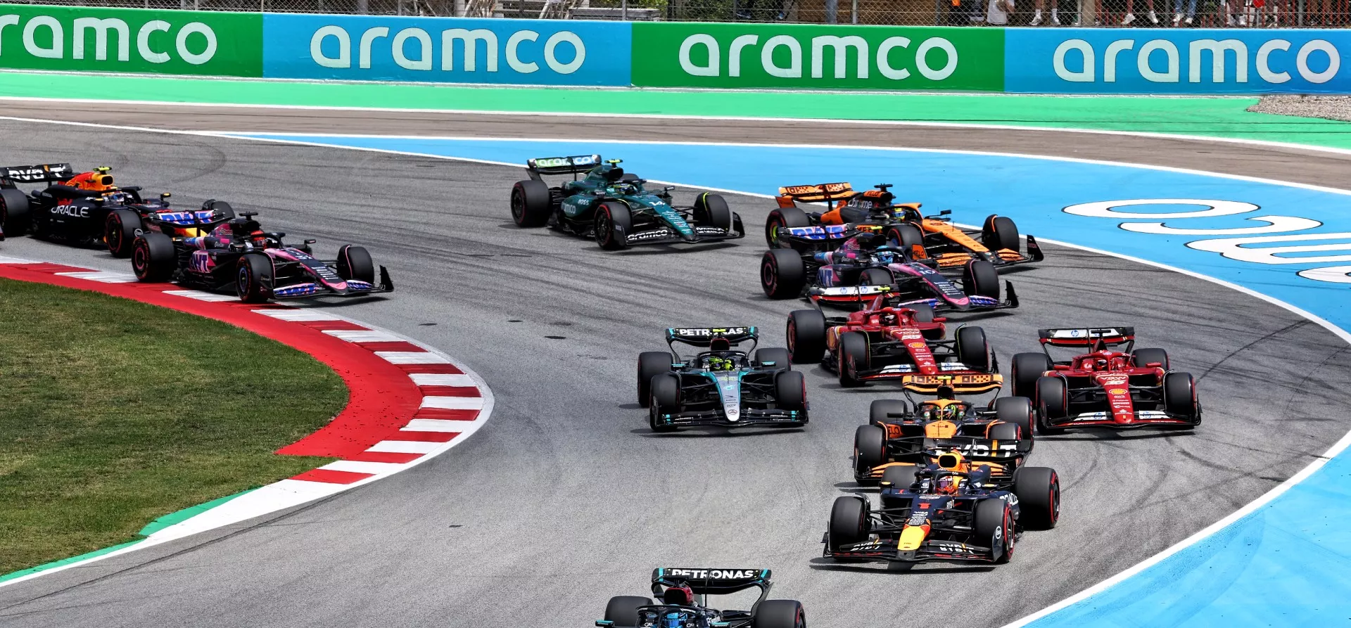 The start of the 2024 Spanish Grand Prix with numerous cars going through a corner