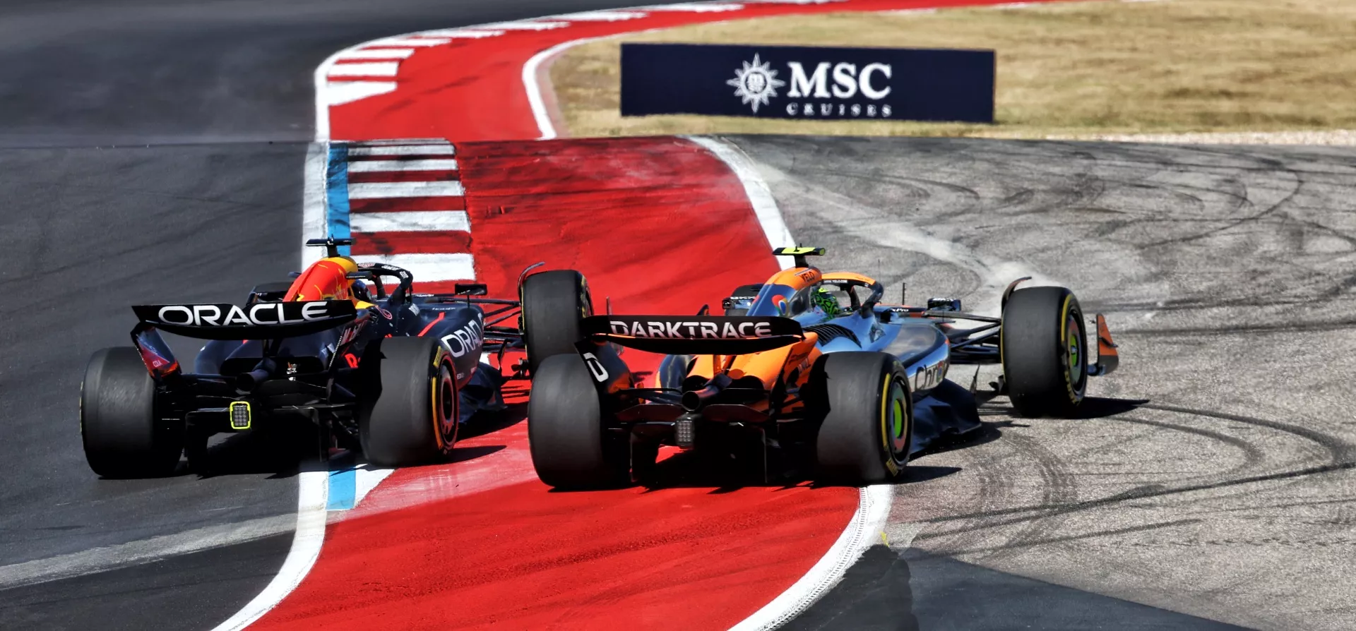 Two cars going wheel to wheel at the 2024 United States Grand Prix 