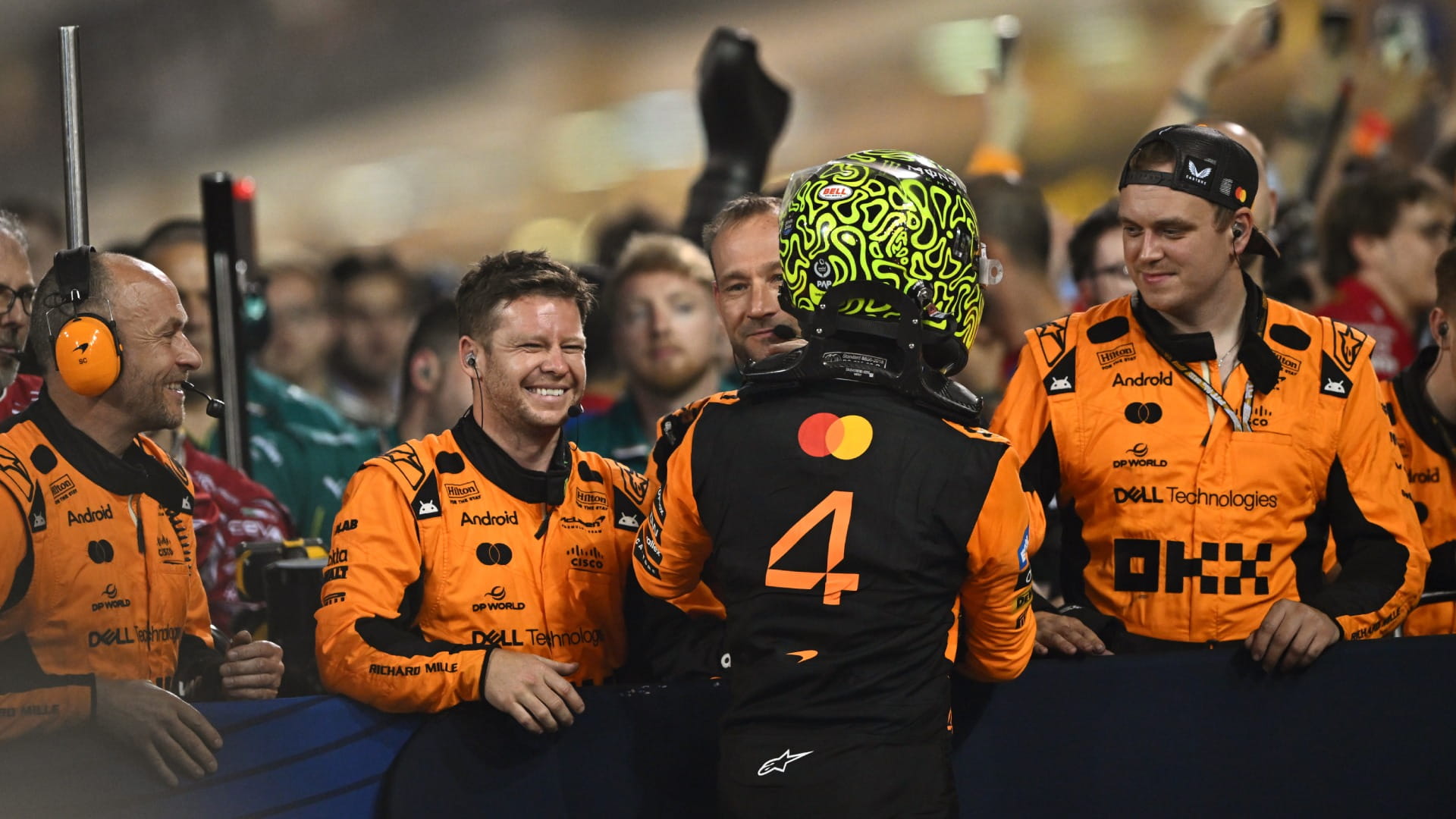Lando Norris celebrating his 2025 Bahrain GP podium with McLaren F1 engineers