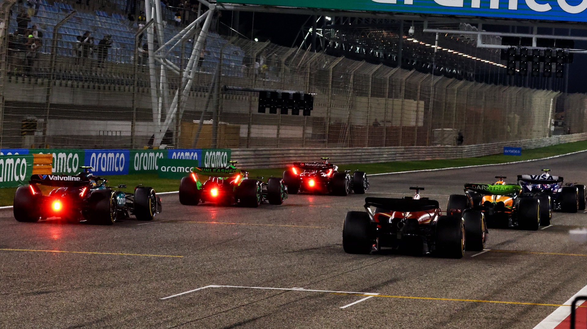 2024 F1 testing practice start, cars lined up on the grid at nighttime