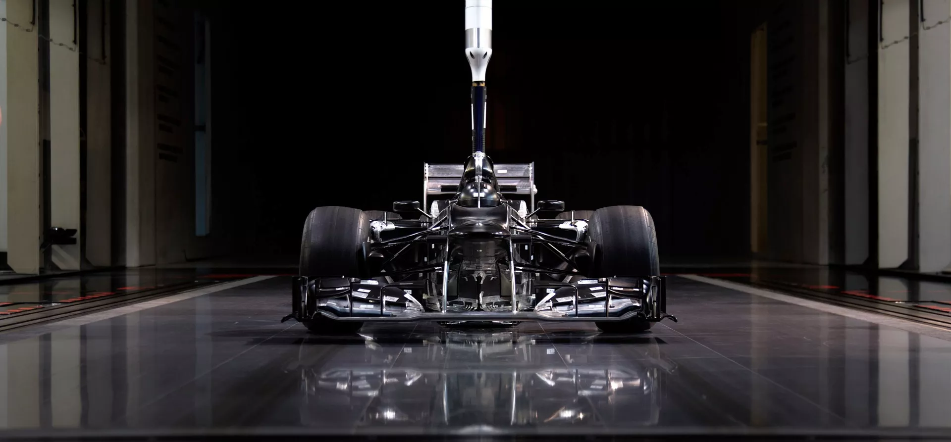 Scale model of a Mercedes F1 car inside a windtunnel