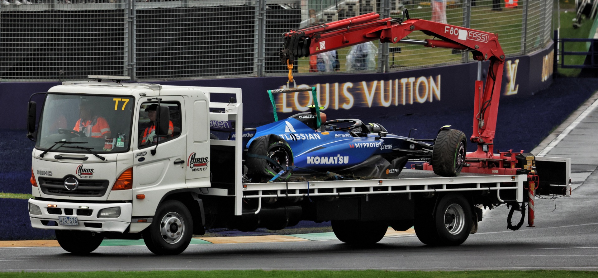 Carlos Sainz's Williams on the back of a truck at Melbourne 2025