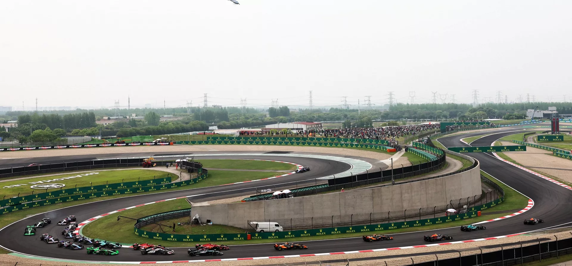 F1 Cars file through the opening corners, 2024 Chinese Grand Prix