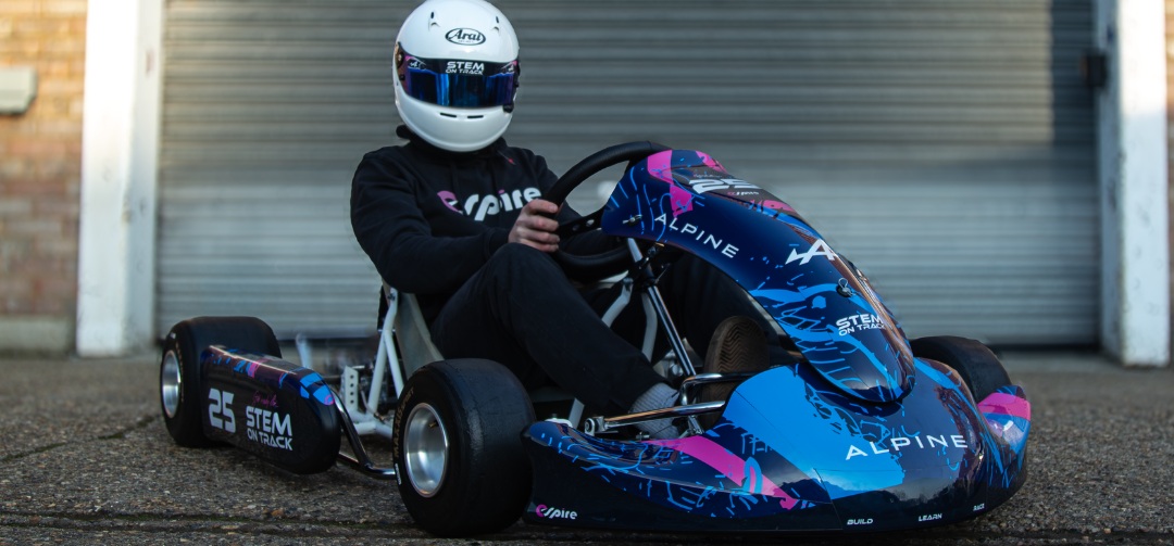 Driver in an Alpine-liveried go-kart