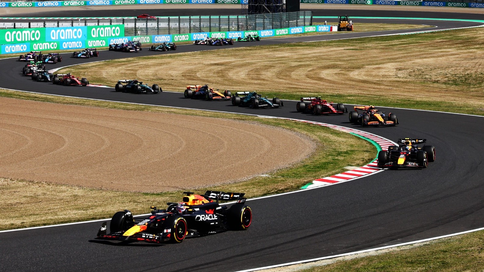 Cars traversing the opening corners during the 2024 Formula 1 Japanese Grand Prix