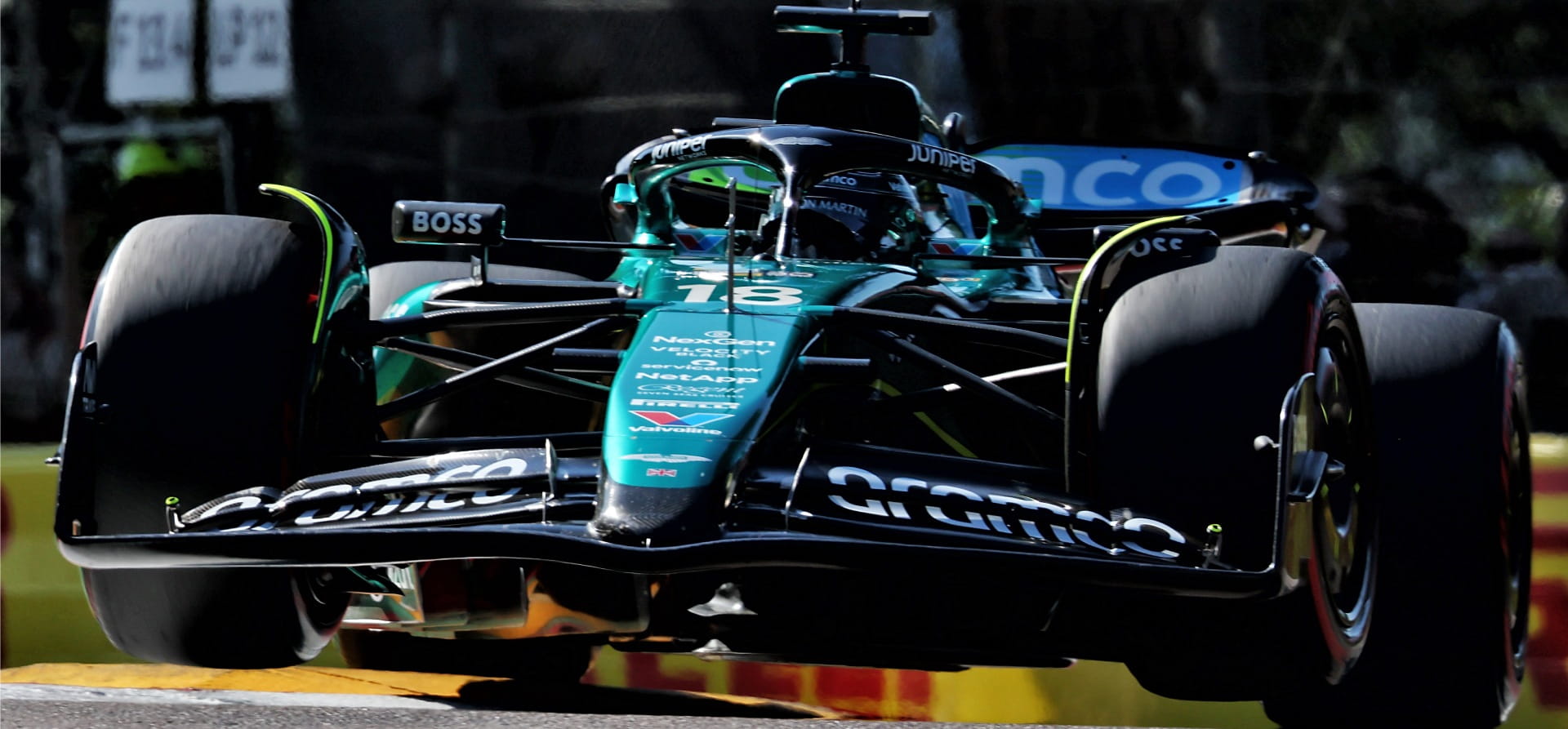 Aston Martin F1 car going over kerbs