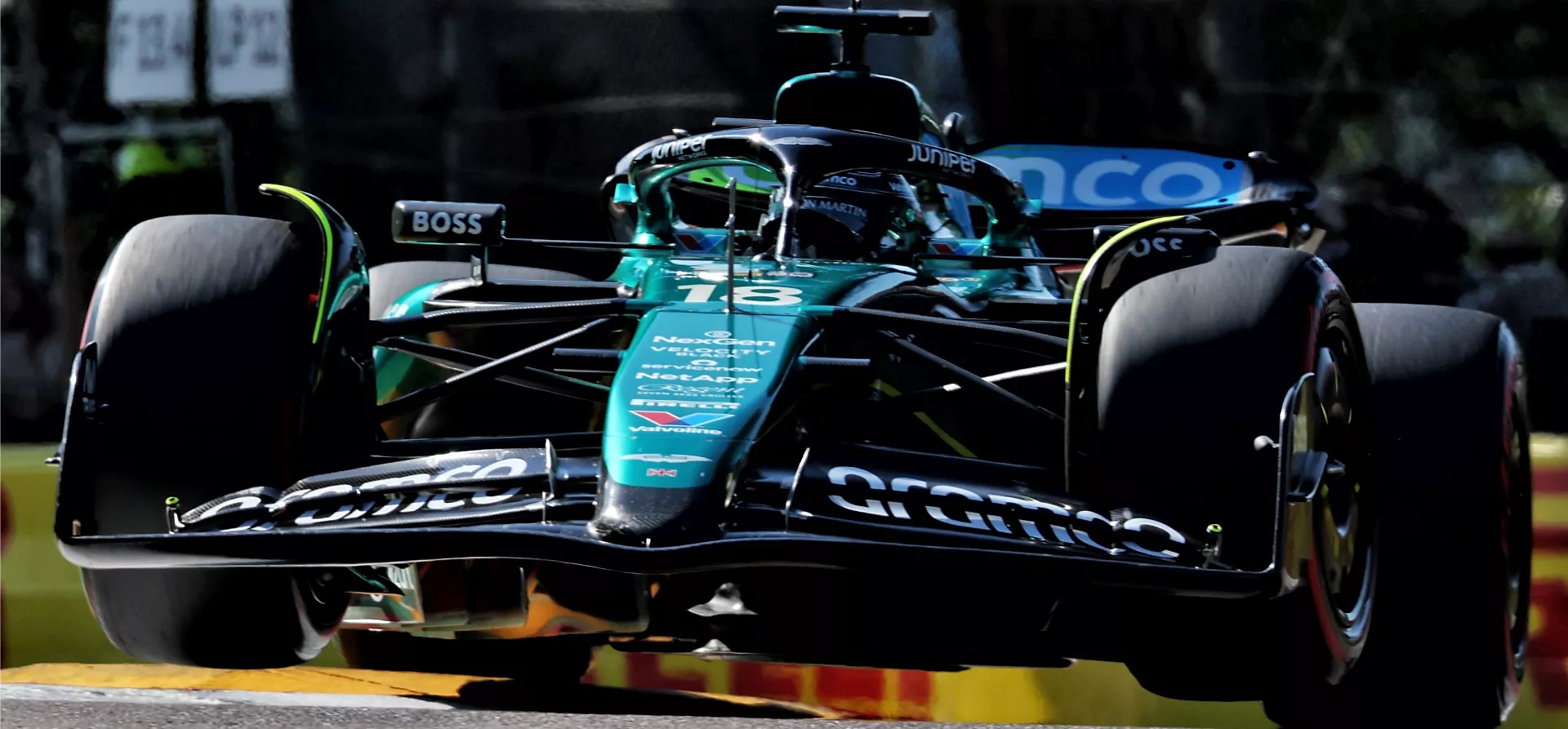 Aston Martin F1 car going over kerbs