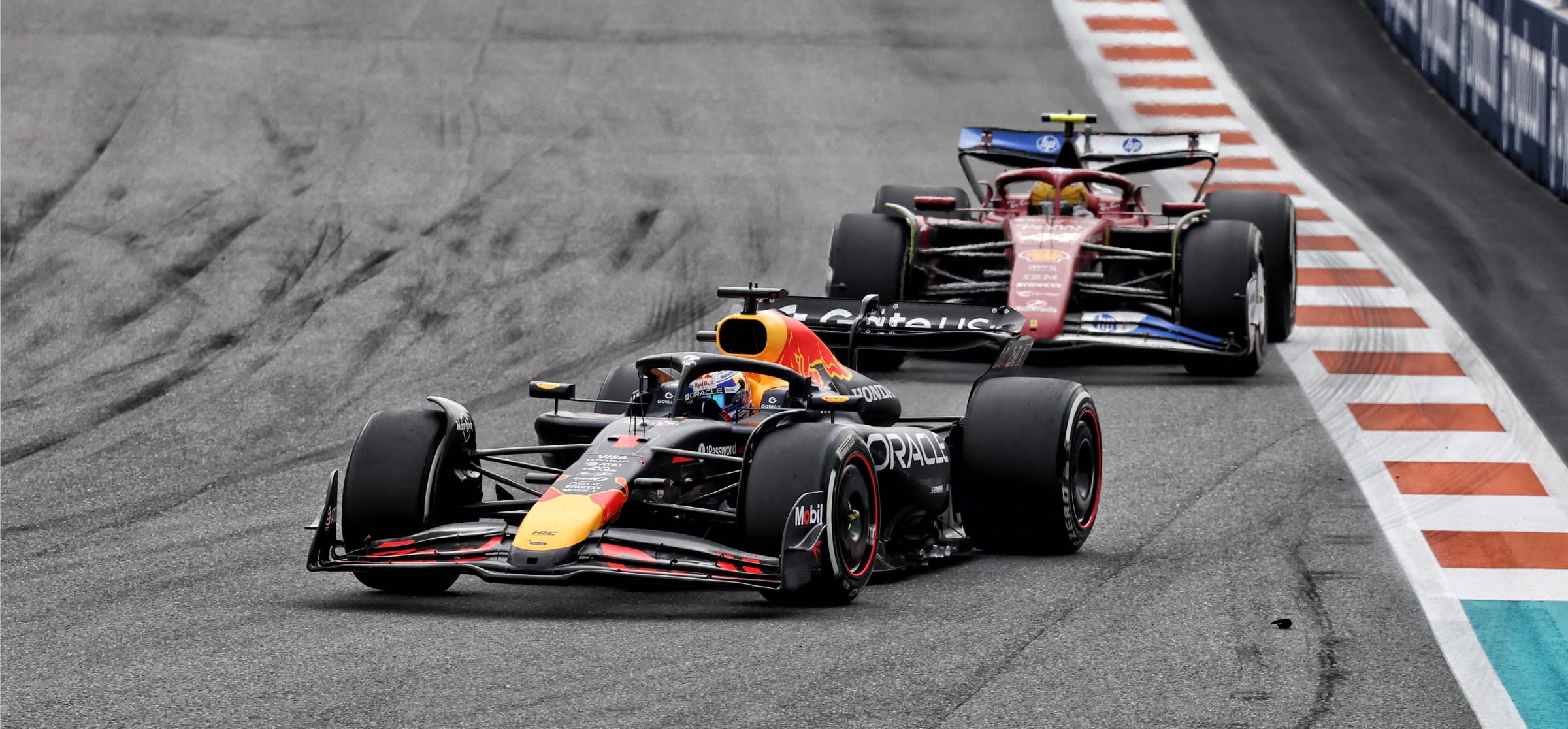 Ferrari F1 car following red Bull F1 car