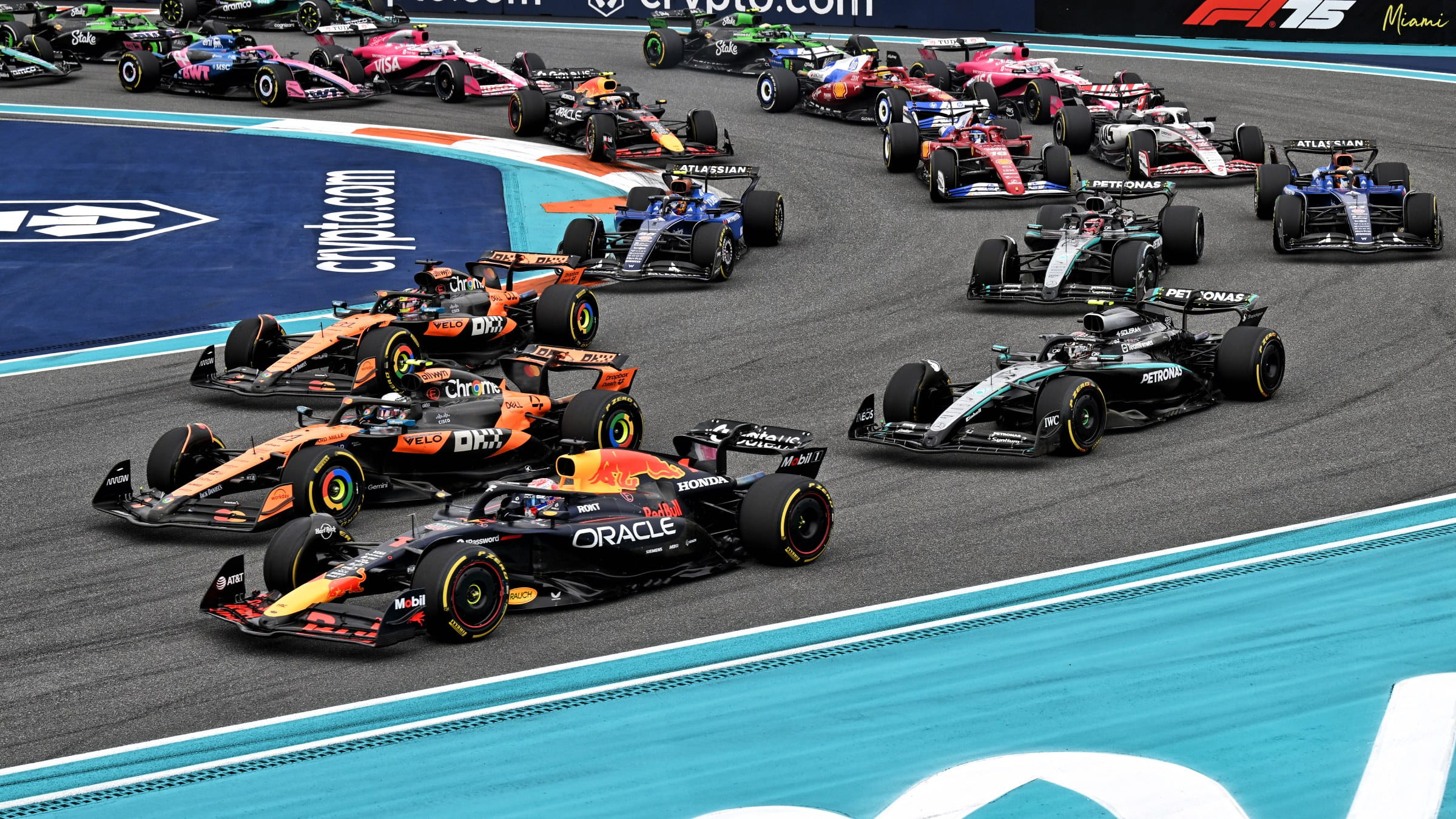 F1 2025 Miami Grand Prix start, Max Verstappen around the outside of Oscar PIastri