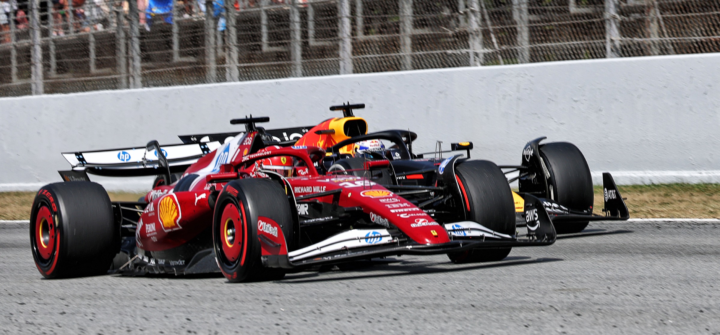 Red Bull F1 car next to a Ferrari F1 car