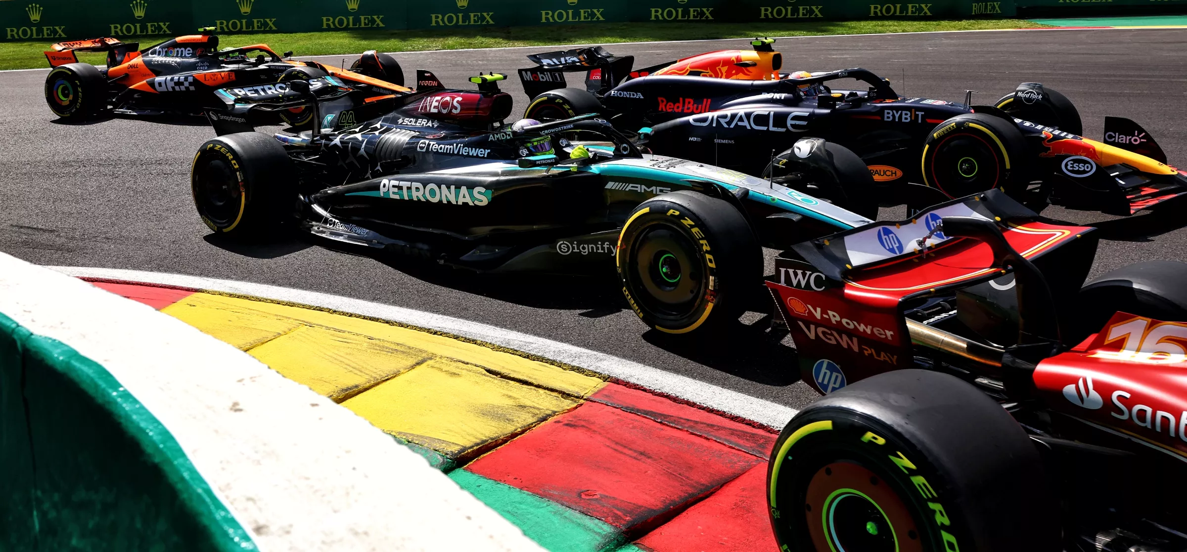 Cars at La Source at the start of the 2024 Belgian Grand Prix