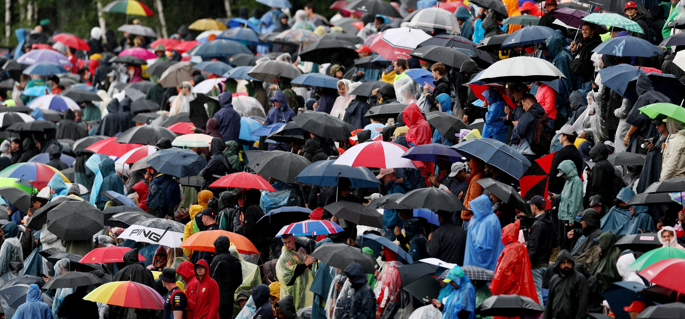 Fans donning umbrellas at the 2025 Belgian Grand Prix