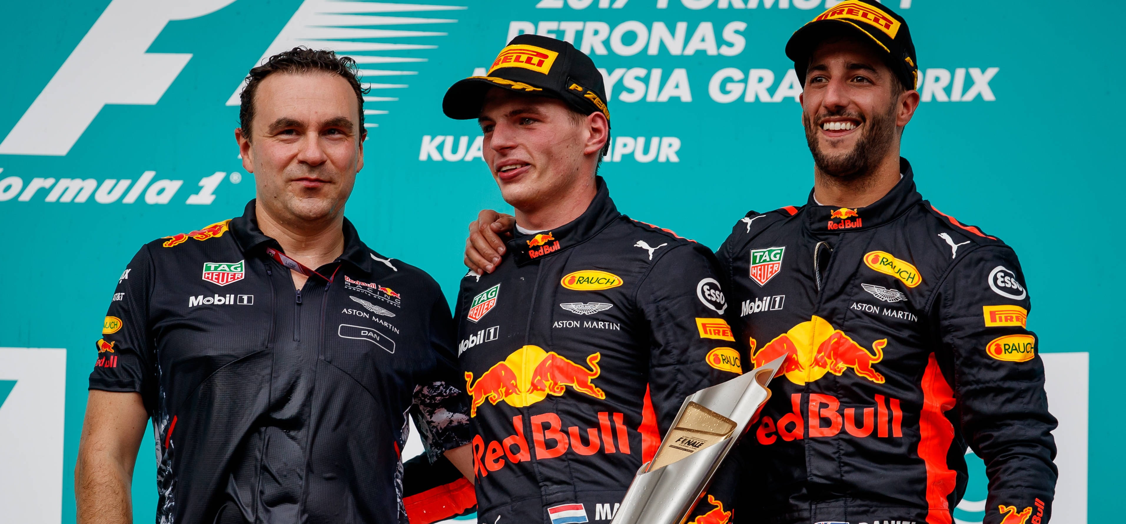 2017 malaysian grand prix podium, dan fallows with verstappen and ricciardo