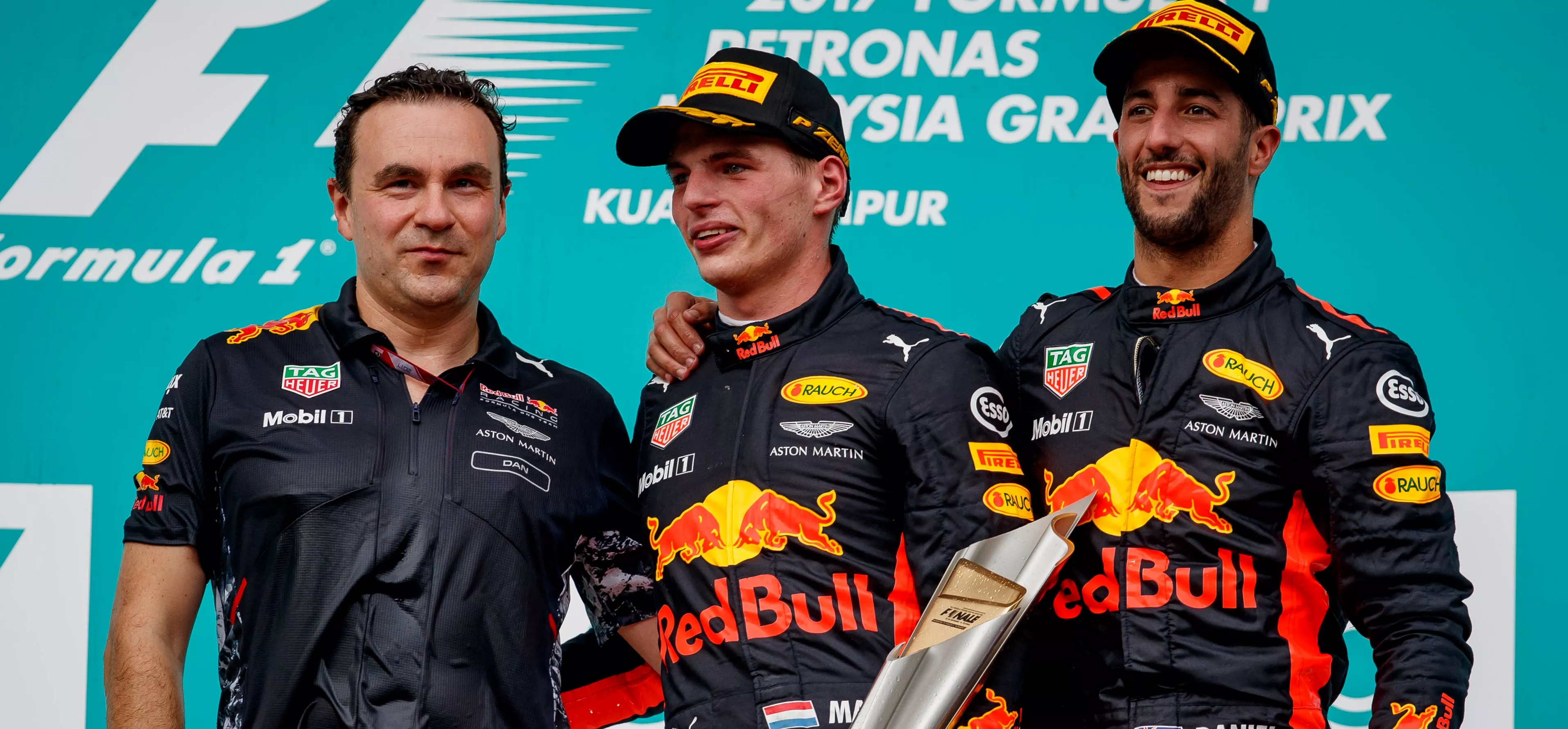 2017 malaysian grand prix podium, dan fallows with verstappen and ricciardo