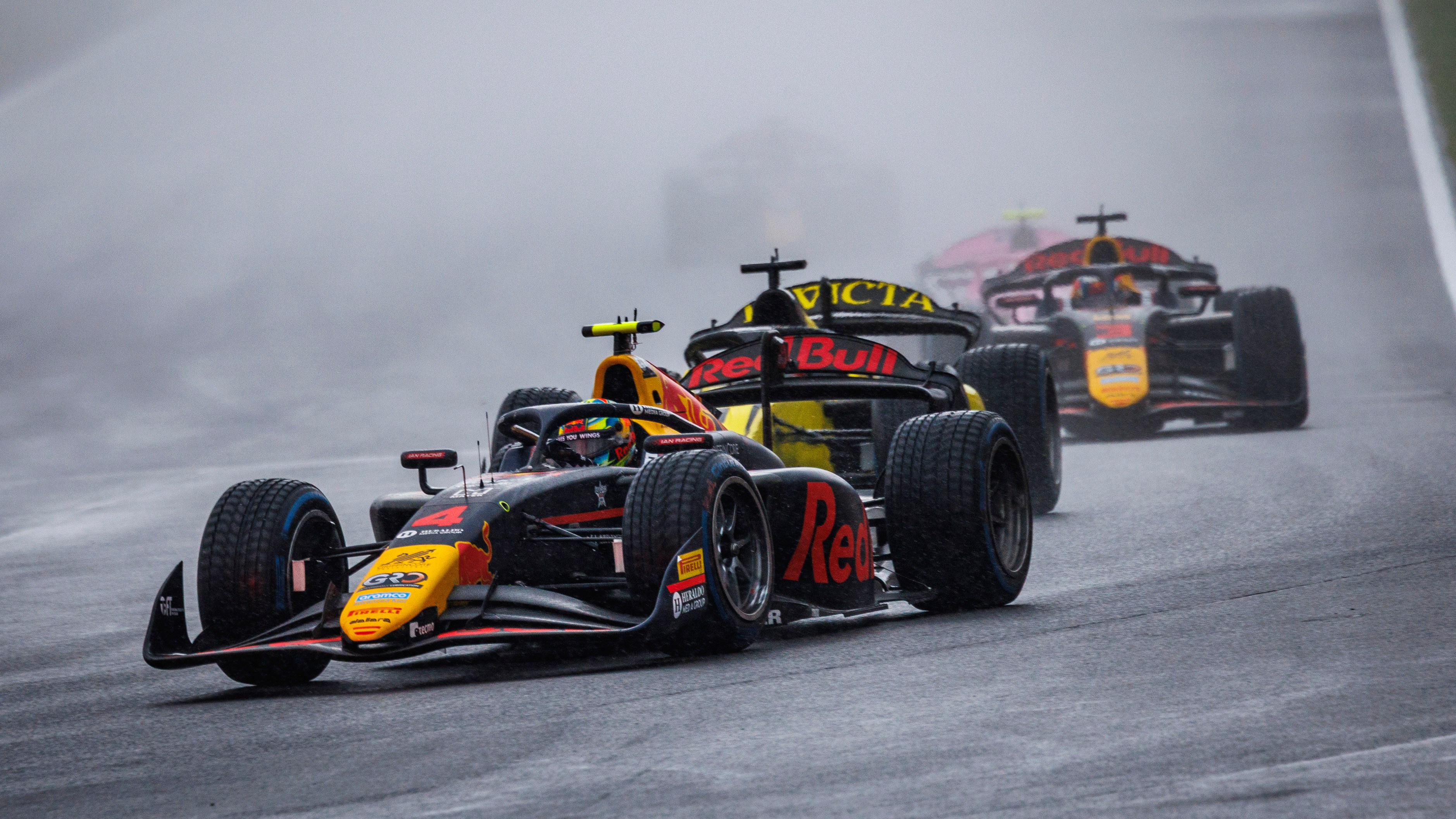 F2 cars in the rain