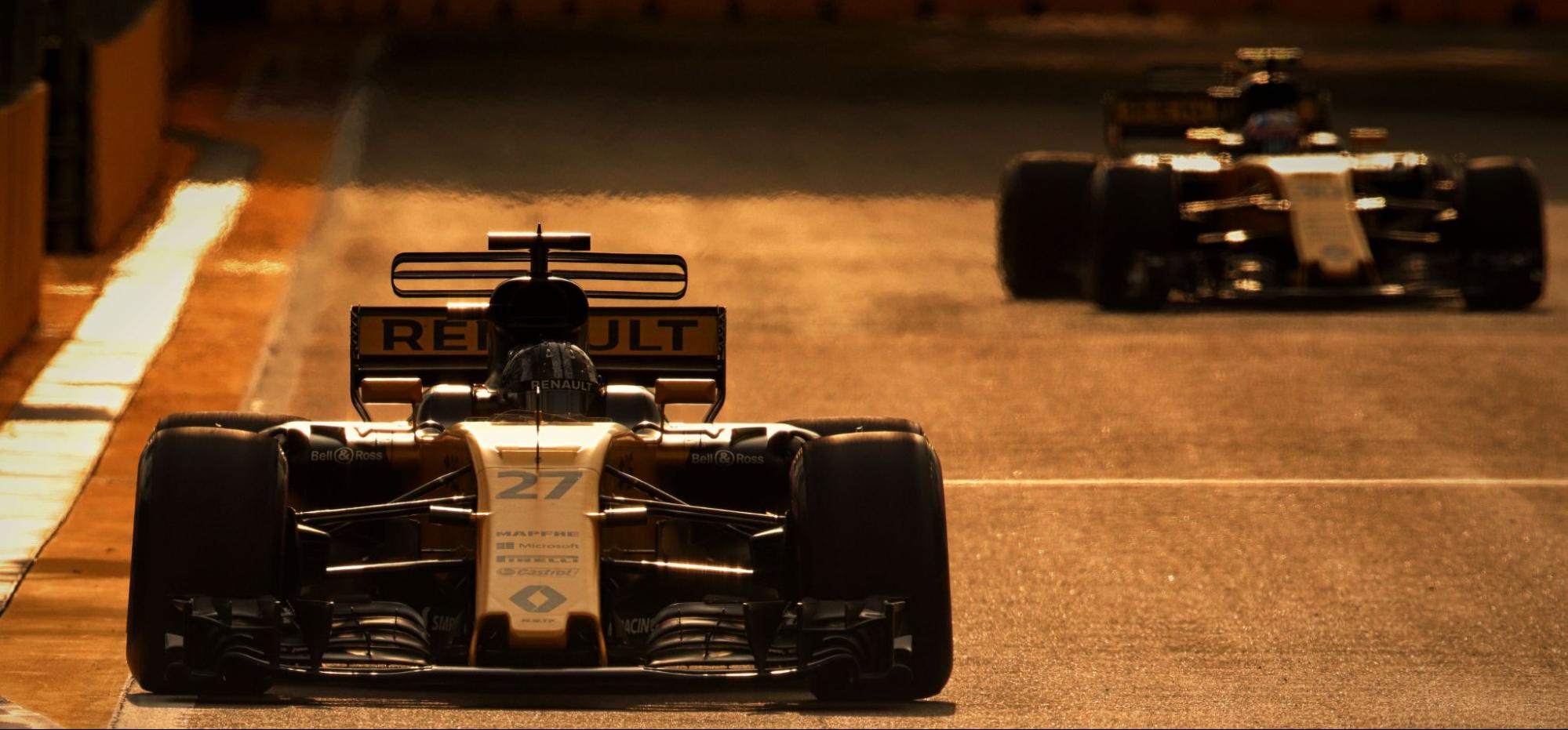 Renault F1 cars in sunset