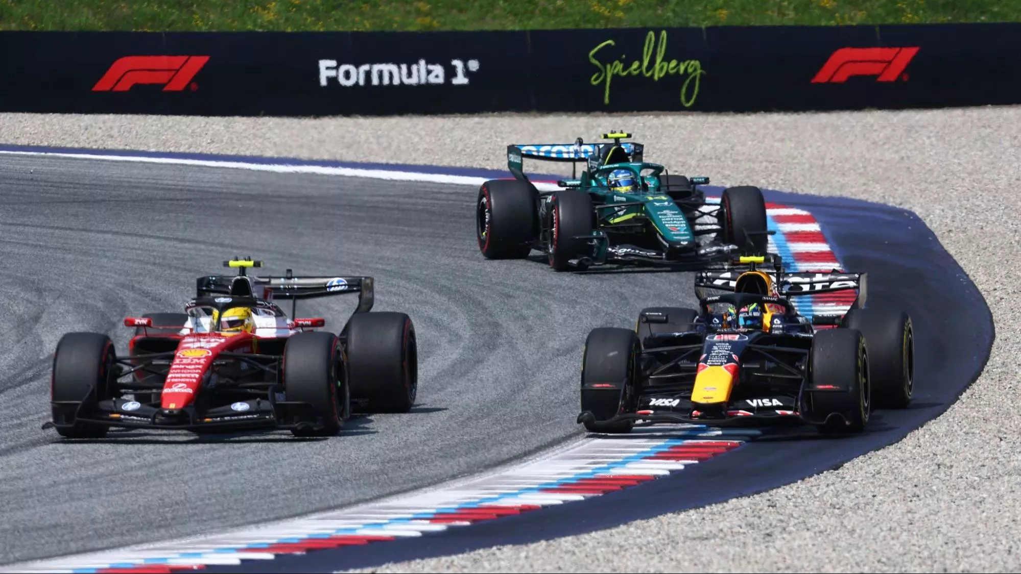 3 F1 cars - Ferrari, Red Bull, and Aston Martin