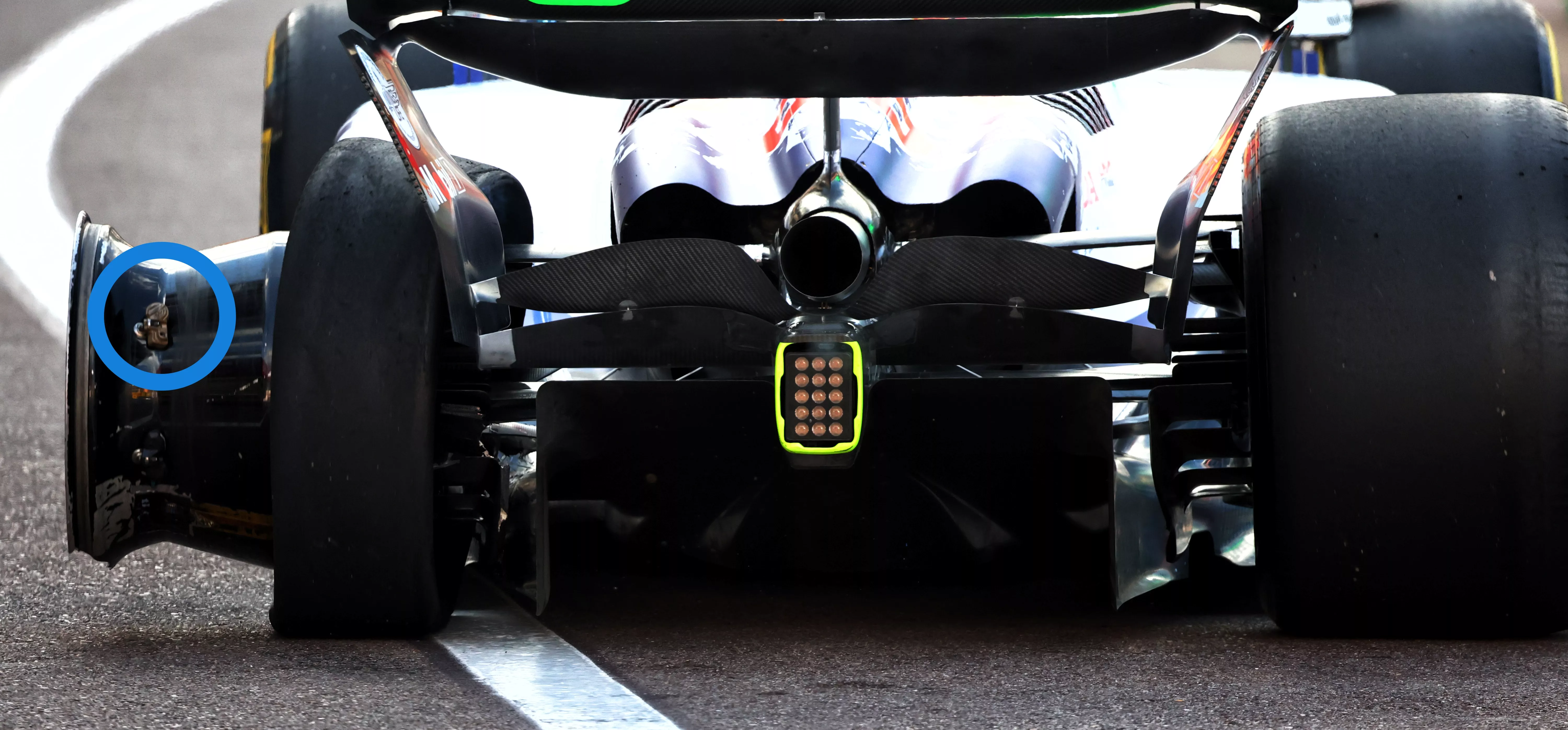 The stricken Racing Bulls of Liam Lawson at the 2025 Dutch GP with the TPMS visible and circled in blue (left)
