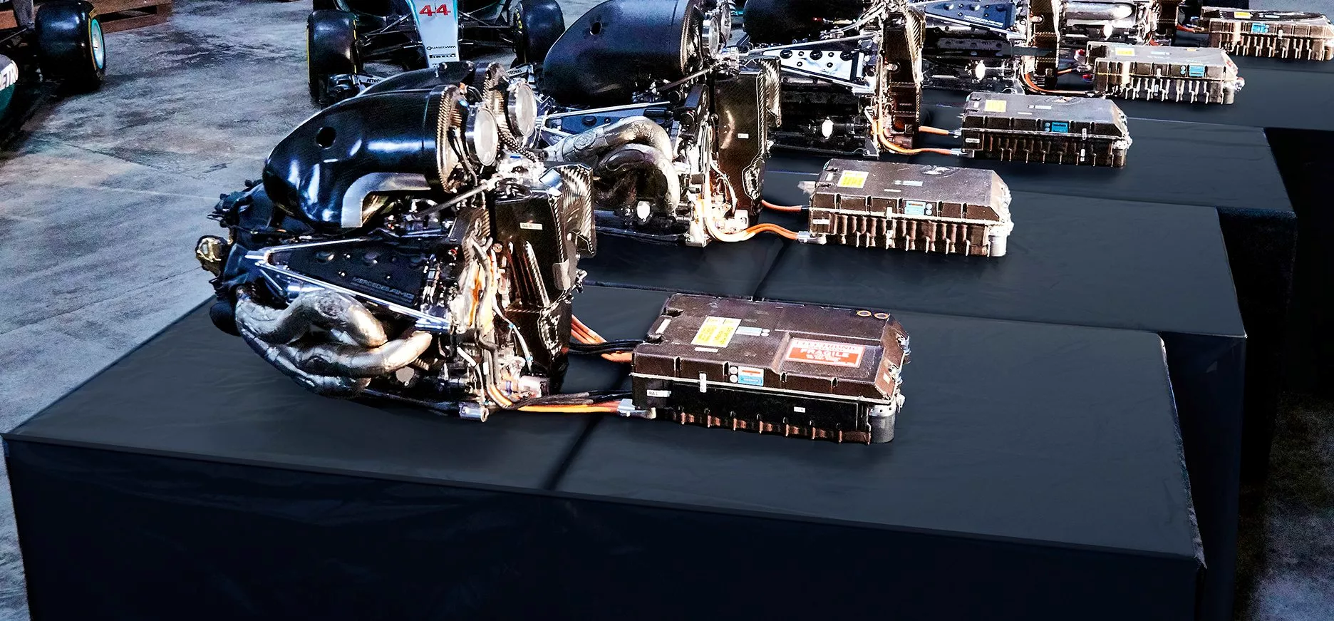 A Mercedes F1 power unit with the battery for the ERS (energy recovery system) in front of it