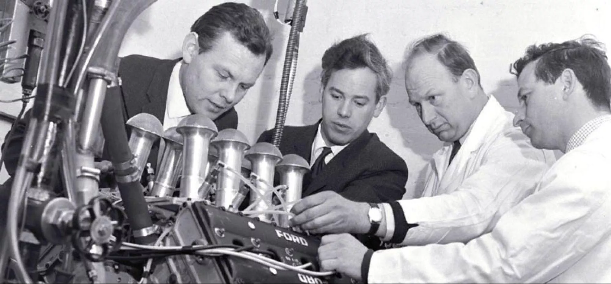 (Left to right) Bill Brown, Keith Duckworth, Mike Costin and Ben Rood working on the Cosworth DFV engine